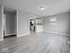 Open-concept living space, with hardwood flooring and a clear view to the connected kitchen at 618 Miller Ave, Shelbyville, IN 46176