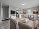 Comfortable living room featuring modern decor and an open floor plan leading into the kitchen at 618 Miller Ave, Shelbyville, IN 46176