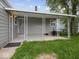 Covered back porch with decorative support columns and a view of the backyard at 618 Miller Ave, Shelbyville, IN 46176