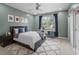 Well-lit bedroom featuring a bed, desk, accent rug, and stylish decor at 654 N Senate Ave, Indianapolis, IN 46202