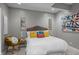 Comfortable bedroom featuring a cozy bed, side table, and colorful throw pillows at 654 N Senate Ave, Indianapolis, IN 46202