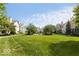 Lush green lawn and well-manicured landscaping in a welcoming community setting at 654 N Senate Ave, Indianapolis, IN 46202