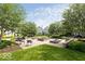 Community space featuring a fire pit, benches, and beautiful landscaping for outdoor gatherings at 654 N Senate Ave, Indianapolis, IN 46202