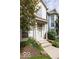 Welcoming two-story home with a cozy front entrance, beautiful landscaping, and natural light at 654 N Senate Ave, Indianapolis, IN 46202