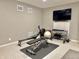 Home gym space featuring exercise equipment including a weight rack, bench, and rowing machine at 654 N Senate Ave, Indianapolis, IN 46202