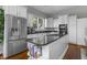Modern kitchen with stainless steel appliances, granite countertops, and a functional island for cooking and gathering at 654 N Senate Ave, Indianapolis, IN 46202
