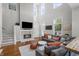 Bright and airy living room with a cozy fireplace, plush seating, and modern decor, creating a welcoming atmosphere at 654 N Senate Ave, Indianapolis, IN 46202