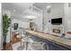 Open-concept living area with an inviting fireplace, modern kitchen, and seamless flow for entertaining at 654 N Senate Ave, Indianapolis, IN 46202