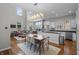 Open concept living space featuring modern kitchen, dining area, and a comfortable lounge area perfect for gatherings at 654 N Senate Ave, Indianapolis, IN 46202