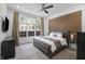 Serene bedroom with a modern accent wall, plush bedding, and abundant natural light for a restful retreat at 654 N Senate Ave, Indianapolis, IN 46202