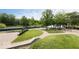 Relax by the tranquil community pond surrounded by lush greenery, and walking paths at 654 N Senate Ave, Indianapolis, IN 46202