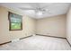 Inviting bedroom features carpet, ceiling fan, neutral walls, and natural light from the window at 659 Carson Ct, Carmel, IN 46033