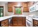 Charming kitchen with wood cabinets, white countertops, and modern appliances at 659 Carson Ct, Carmel, IN 46033