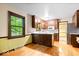 Eat-in kitchen featuring wood cabinets and a view of the outdoors at 659 Carson Ct, Carmel, IN 46033