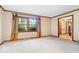 Bright living room featuring plush carpet, natural light, and a view into an entry foyer at 659 Carson Ct, Carmel, IN 46033