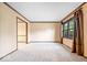 Bright and airy living room with neutral carpet and trim at 659 Carson Ct, Carmel, IN 46033