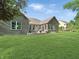 A spacious yard with a patio featuring outdoor seating at 6693 W May Apple Dr, McCordsville, IN 46055