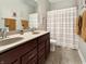 Bathroom with double sinks, a large mirror, and modern fixtures at 6693 W May Apple Dr, McCordsville, IN 46055