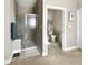 Bathroom featuring a walk-in shower and separate toilet room for added privacy at 6693 W May Apple Dr, McCordsville, IN 46055