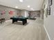 Game room includes a billiards table and ping pong, plus assorted wall decor and lighting at 6693 W May Apple Dr, McCordsville, IN 46055