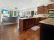 Open kitchen with island, granite countertops, stainless steel appliances, seamlessly connected to a cozy living area at 6693 W May Apple Dr, McCordsville, IN 46055