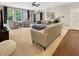 Bright living room with plush furnishings and lots of natural light at 6693 W May Apple Dr, McCordsville, IN 46055