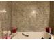 Bathroom showcasing clean, gray tiled walls, a soaking tub, and modern fixtures for a relaxing experience at 670 Van Ave, Shelbyville, IN 46176