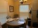 An inviting breakfast nook features a round table, ample natural light, and cozy seating for casual dining at 670 Van Ave, Shelbyville, IN 46176