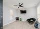 A well-lit room featuring a ceiling fan, carpet, and a comfortable layout for relaxation and entertainment at 7077 Antiquity Dr, Carmel, IN 46033