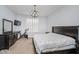 Comfortable bedroom with an exercise bike, TV, and neutral decor creating a relaxing atmosphere at 7077 Antiquity Dr, Carmel, IN 46033