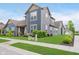 Two-story home featuring blue siding, a well-manicured lawn, and a clean, modern exterior design at 7077 Antiquity Dr, Carmel, IN 46033