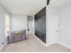 A carpeted hallway with a chalkboard wall that reads 