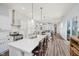 Spacious kitchen with island seating, stainless steel appliances, and an open layout connecting to the living area at 7077 Antiquity Dr, Carmel, IN 46033
