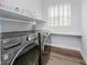 Well-equipped laundry room with modern appliances, built-in shelving, and a functional design for convenience at 7077 Antiquity Dr, Carmel, IN 46033