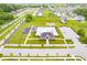 Aerial shot of a community pool, playground, parking lot, and surrounding green spaces at 7077 Antiquity Dr, Carmel, IN 46033