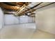 Unfinished basement with white walls, painted floor and exposed open ceiling at 7513 Pine Royal Dr, Indianapolis, IN 46256
