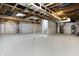 Open basement with bright floor and white walls, partially finished with exposed ceiling at 7513 Pine Royal Dr, Indianapolis, IN 46256