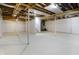 Bright unfinished basement, painted walls and floor, with open ceilings and support beams at 7513 Pine Royal Dr, Indianapolis, IN 46256