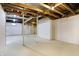 Unfinished basement with white walls, bright floor and open ceiling at 7513 Pine Royal Dr, Indianapolis, IN 46256