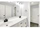 Bright bathroom featuring double vanity, tile floors, large mirror, and shower at 7513 Pine Royal Dr, Indianapolis, IN 46256