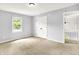 Bedroom featuring carpet, double door closet and staircase at 7513 Pine Royal Dr, Indianapolis, IN 46256