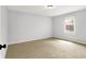 Bright bedroom with carpet, white walls, and natural light from the window at 7513 Pine Royal Dr, Indianapolis, IN 46256