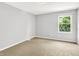 Neutral bedroom with carpet and a single window offering natural light at 7513 Pine Royal Dr, Indianapolis, IN 46256
