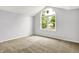 Bedroom with large window offering views of the outside at 7513 Pine Royal Dr, Indianapolis, IN 46256
