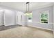 Open-concept dining area featuring neutral tones, stylish lighting, and ample natural light at 7513 Pine Royal Dr, Indianapolis, IN 46256