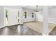Bright and airy foyer leading into a carpeted living space, enhanced by natural light at 7513 Pine Royal Dr, Indianapolis, IN 46256
