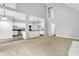 A living room opens into a modern kitchen with an island and stainless steel appliances at 7513 Pine Royal Dr, Indianapolis, IN 46256