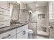 Modern bathroom with tiled shower featuring a built-in seat, and a vanity with a gray countertop at 7575 Central Ave, Indianapolis, IN 46240