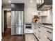 Contemporary kitchen with stainless steel refrigerator and white cabinets at 7575 Central Ave, Indianapolis, IN 46240