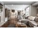 Open-concept living space with a stylish kitchen, cozy seating area, and natural light, creating a welcoming atmosphere at 7575 Central Ave, Indianapolis, IN 46240